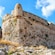 La Fortezza en Creta, Grecia, ubicada en una colina y con fortificación de piedras y torreta